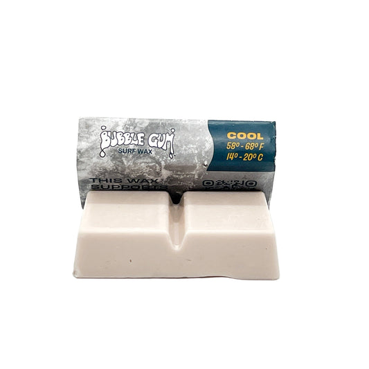 Block of surf wax with packaging on a white background
